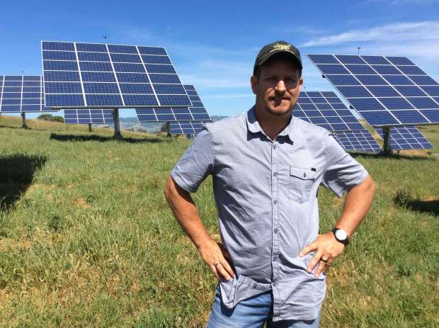 Mark Soiland stands in front of the solar array at Stony Point Quarry near Cotati. (Press Democrat File)