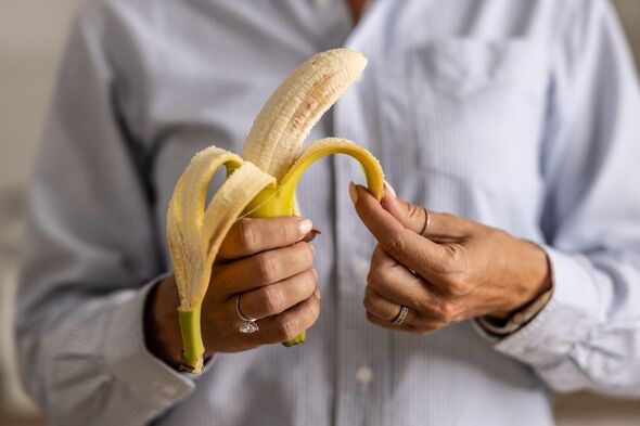 A man peeling a banana