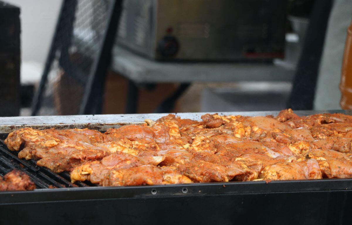 Lamb meet is being prepped on a cooker.