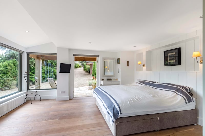 The main bedroom opens to a patio