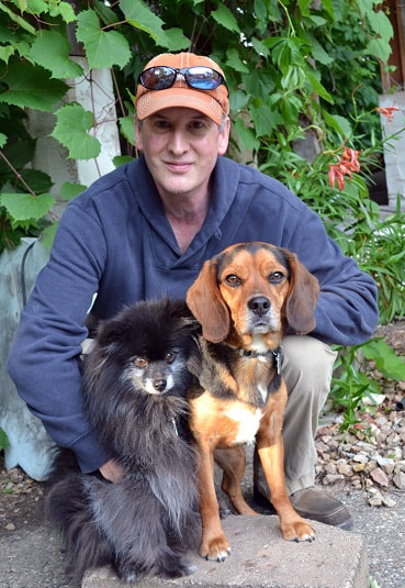 Jeffrey B. Burton, shown with two dogs.