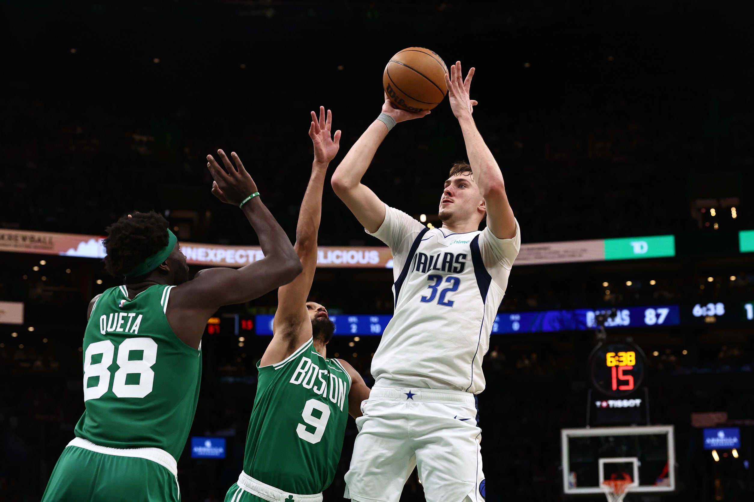 Mar 6, 2026; Boston, Massachusetts, USA; Dallas Mavericks forward Cooper Flagg (32) shoots over Boston Celtics guard Derrick White (9) and center Neemias Queta (88) during the second half at TD Garden. Mandatory Credit: Winslow Townson-Imagn Images