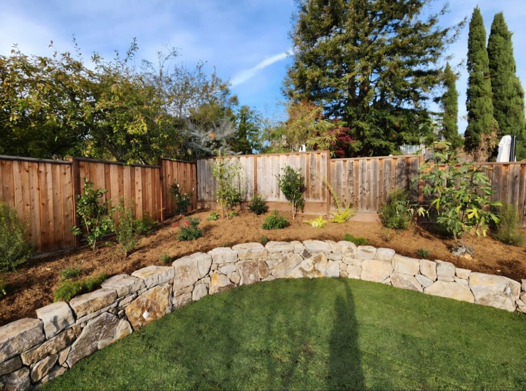 Some dry stacked boulder retaining walls we did on past projects.