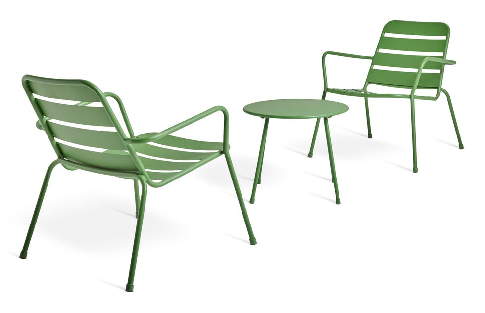 two green chairs and a round table