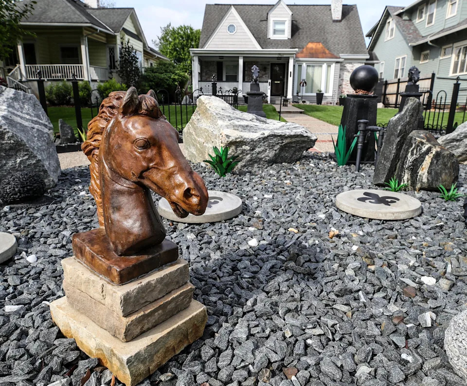 The front yard garden of the home of Mary Armstrong has multiple sculptural pieces and planters. April 30, 2024.