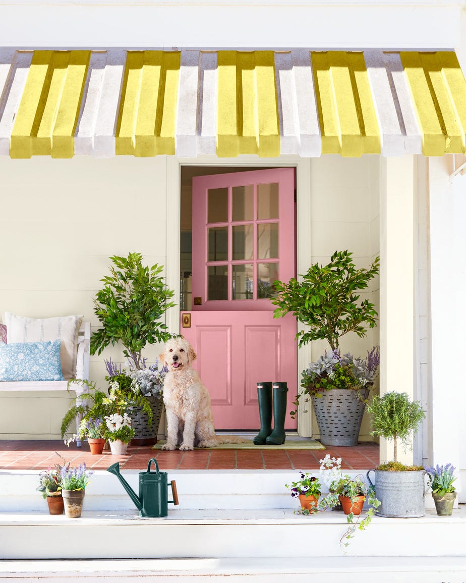 front porch with pink dutch door front porch with pink dutch door, potted plants, and yellow and white awning