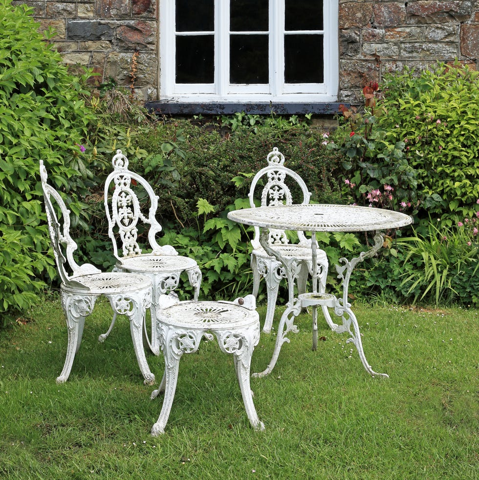 Garden table and chairs in an outdoor patio garden table and chairs in a fishguard garden, pembrokeshire, wales.