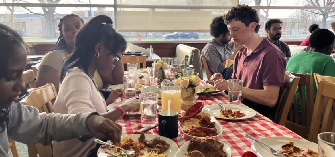Students at Garden of Joy cook a meal to share with volunteers, family and friends.