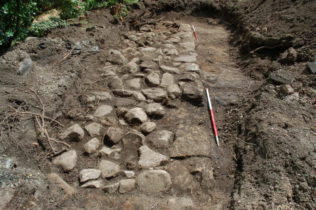 A kerbed stone base was discovered in the back gardens.