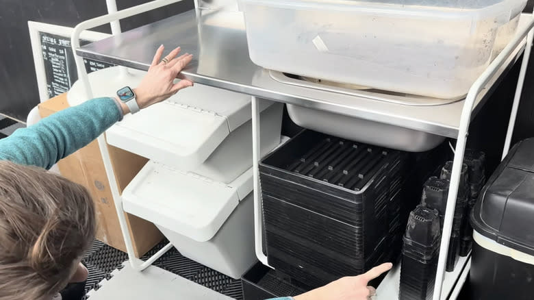 IKEA SUNNERSTA kitchenette configured as a potting bench station with bins and trays stored below