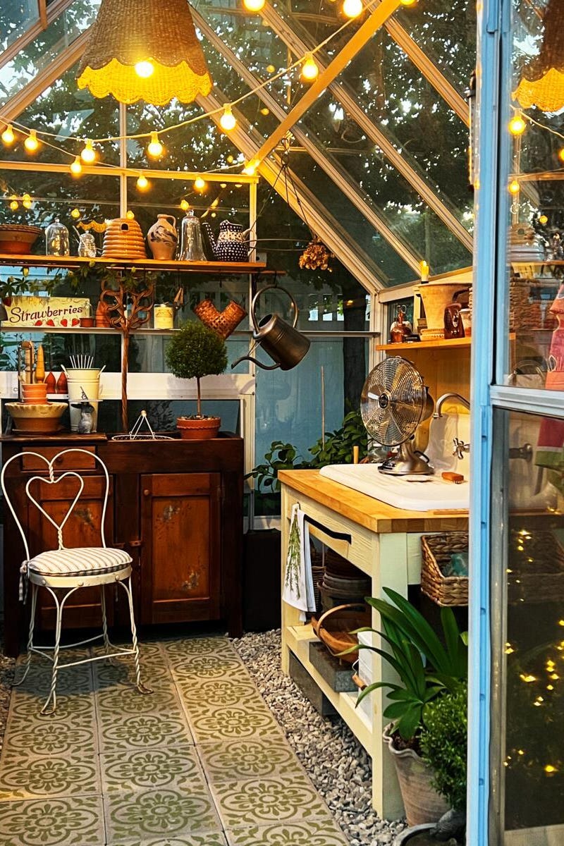 greenhouse interior with various garden supplies and decor