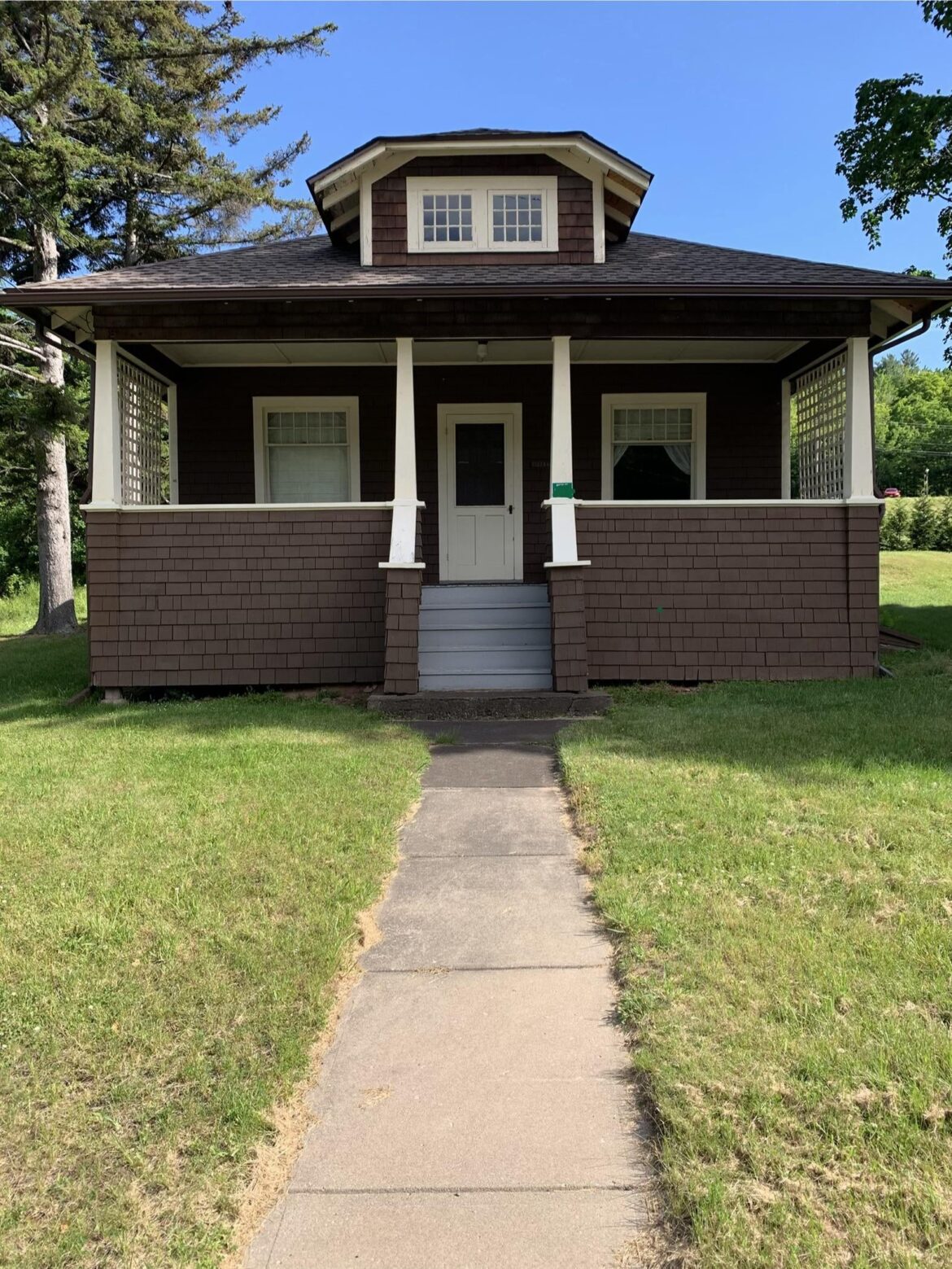 What should I plant on either side of the porch steps?