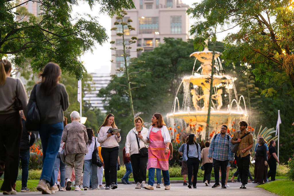 people walking in Carlton Gardens with the big fountain in the background during the Melbourne International Flower and Garden Show