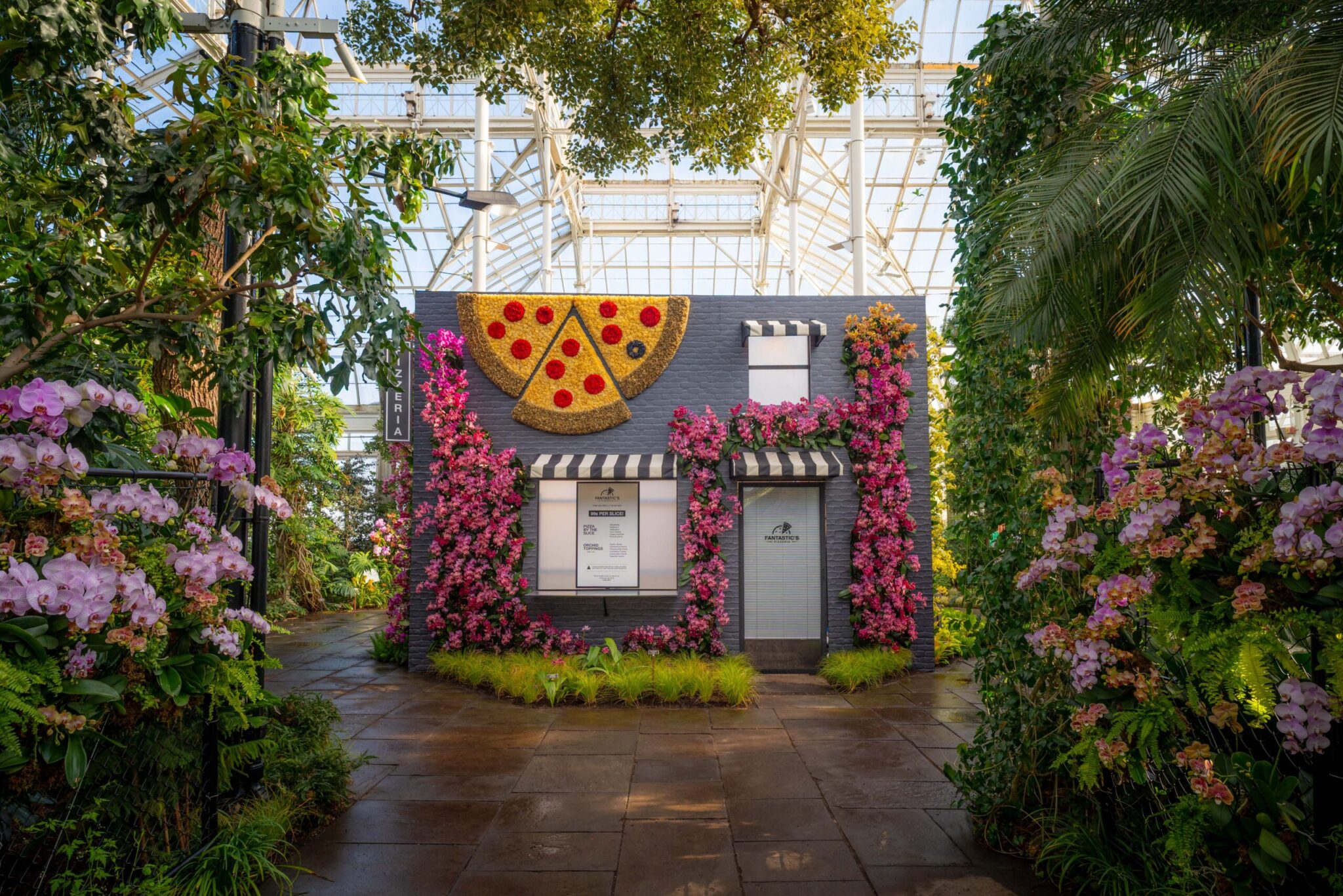 Pizza stop featured in “The Orchid Show: Mr. Flower Fantastic’s Concrete Jungle,” on view at NYBG in the Bronx.