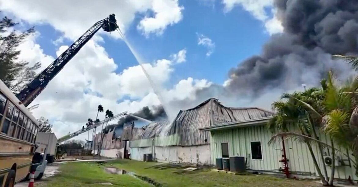 Over 100 firefighters battle large warehouse fire in Miami Gardens