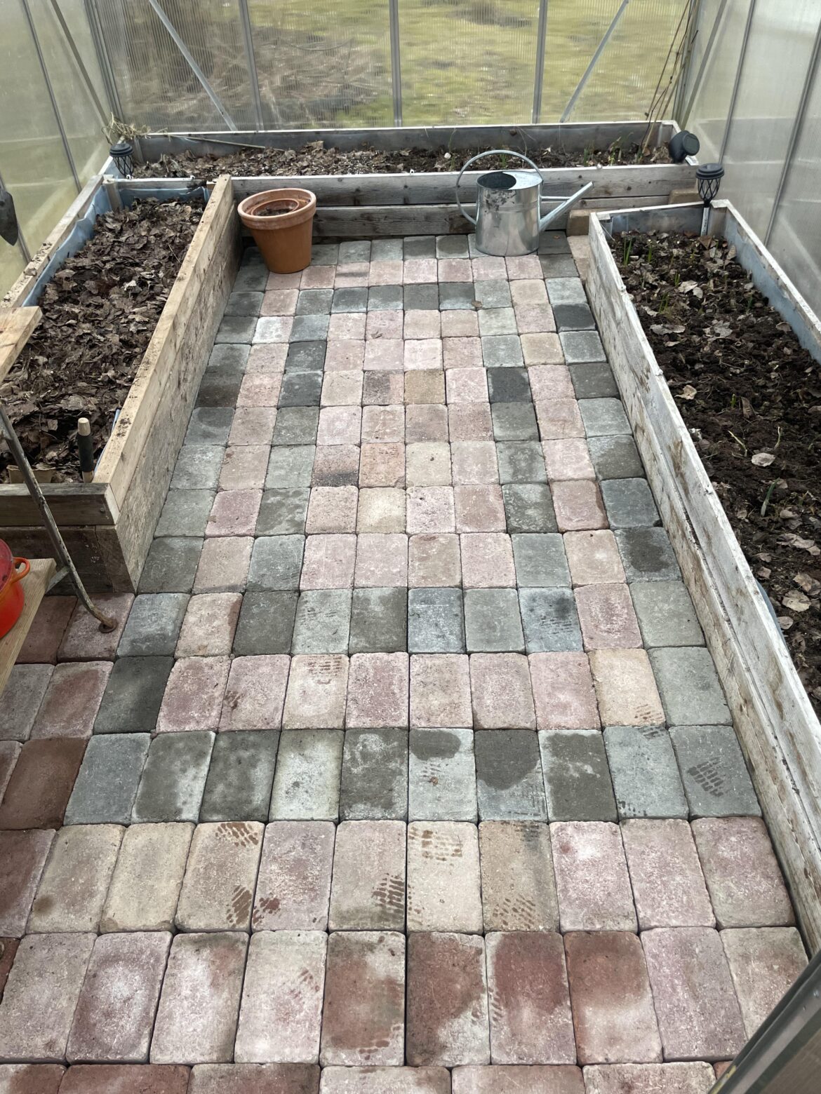 Put in paving stones. Put in paving stones.