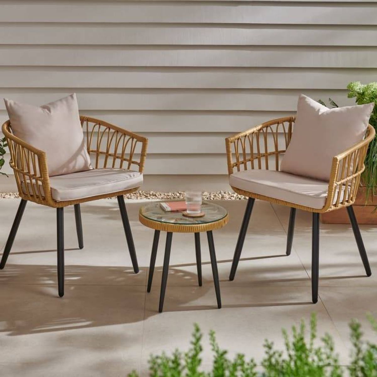 An image of a three-piece bistro set in an outdoors space