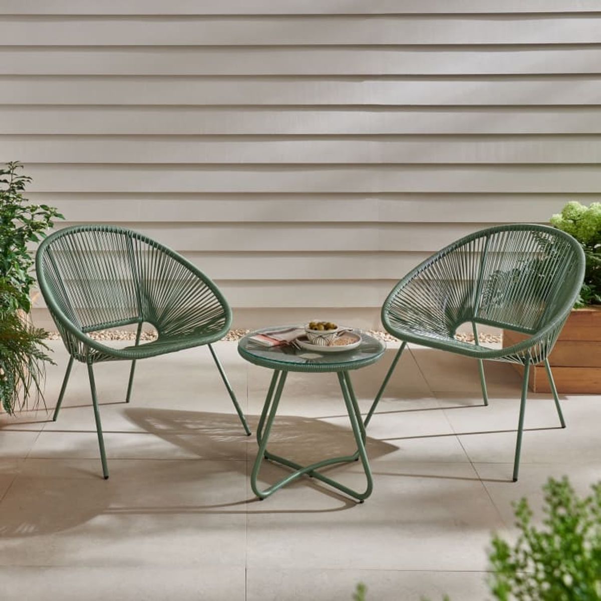 An image of a strong-effect three-piece bistro set in an outdoors setting