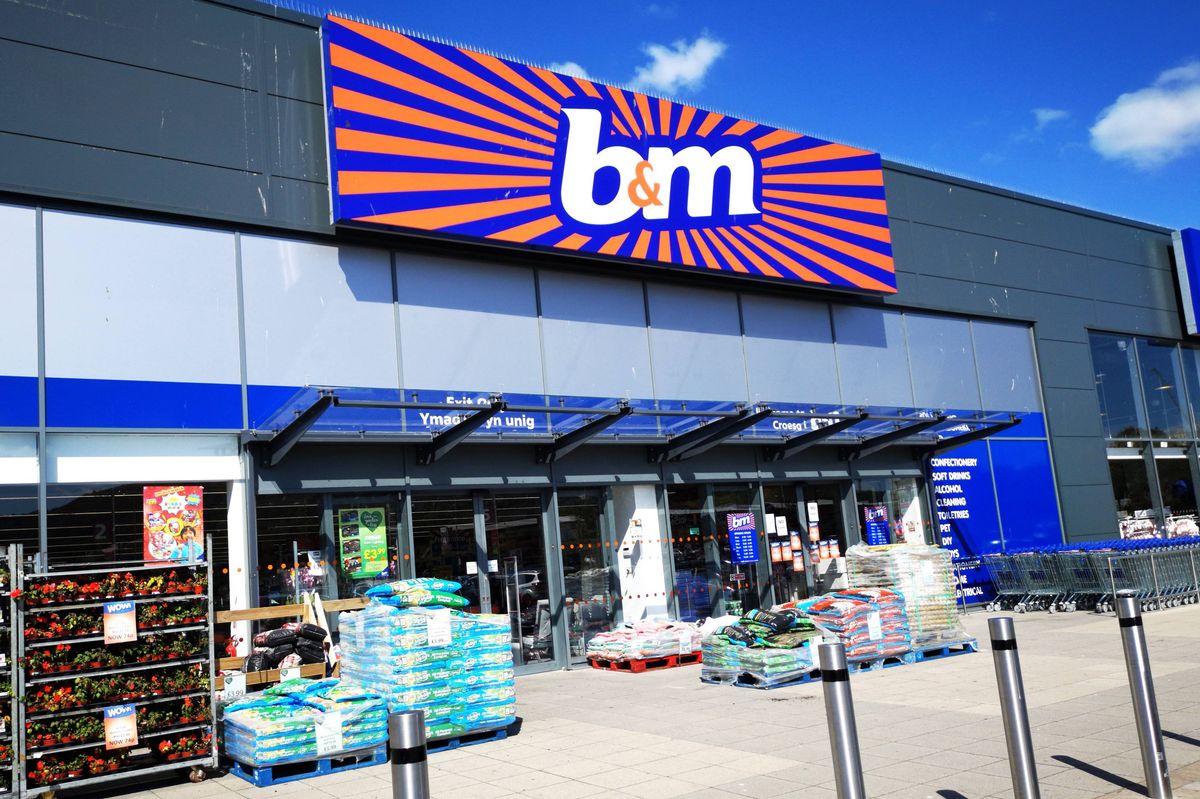 B&M Bargains retail shop front with merchandise and bargain items displayed outside.