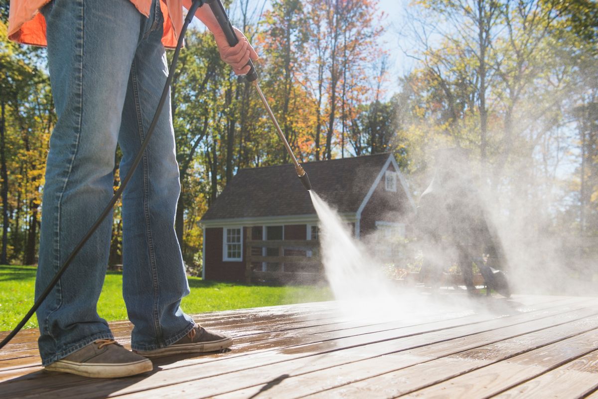 Person using pressure washer