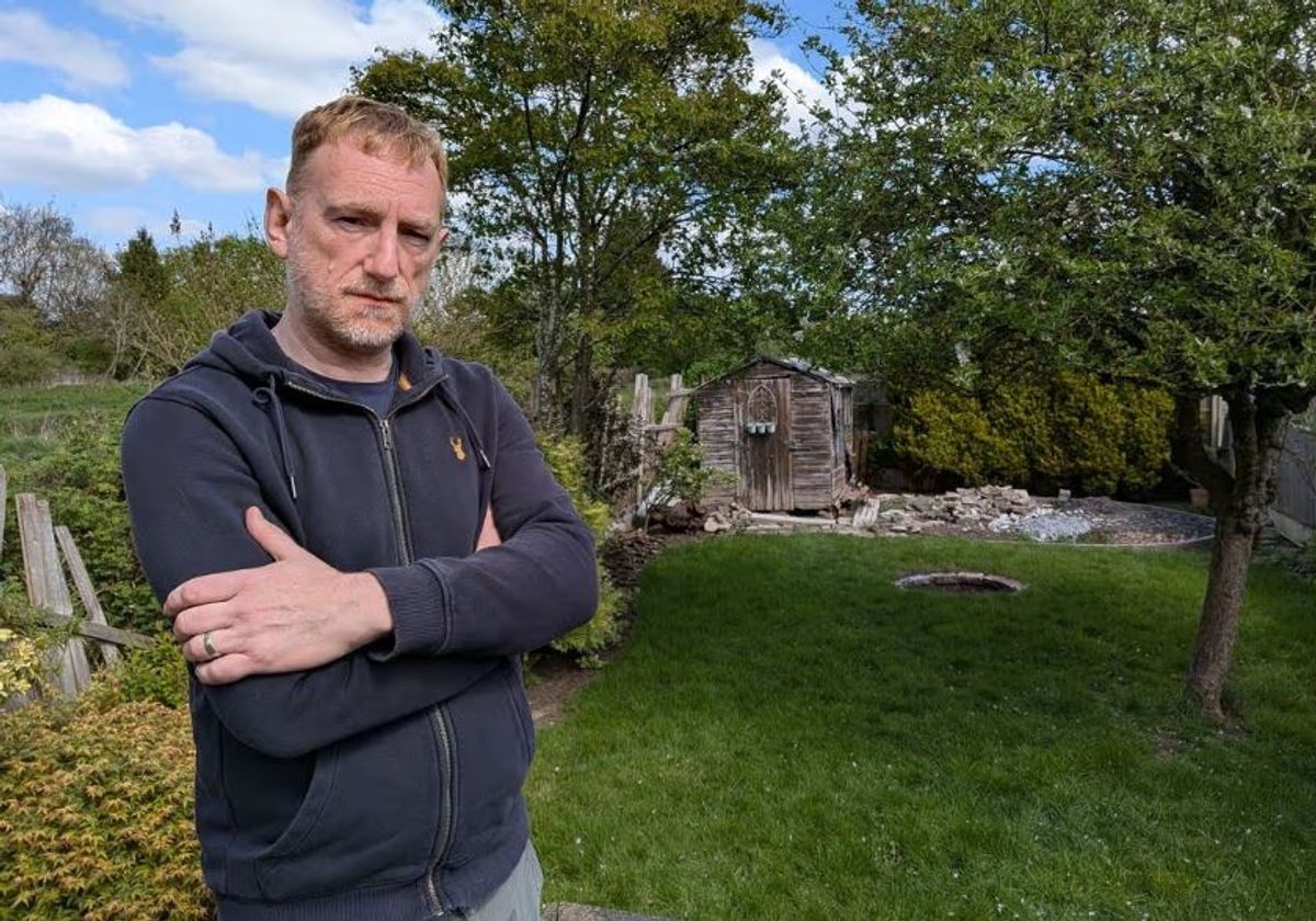 David Woodhouse in his garden in Doncaster Grove, Long Eaton, half of which he must now either rent, buy or lose (Image: Derby Telegraph)