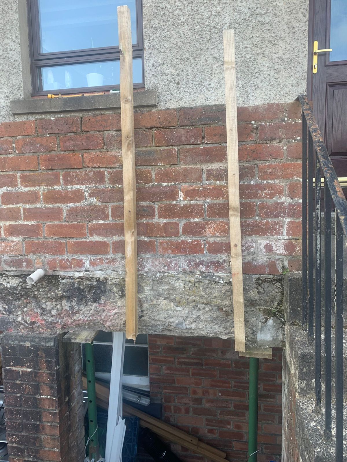 Two wooden posts have been fitted to stop the wobbly wall from going over.