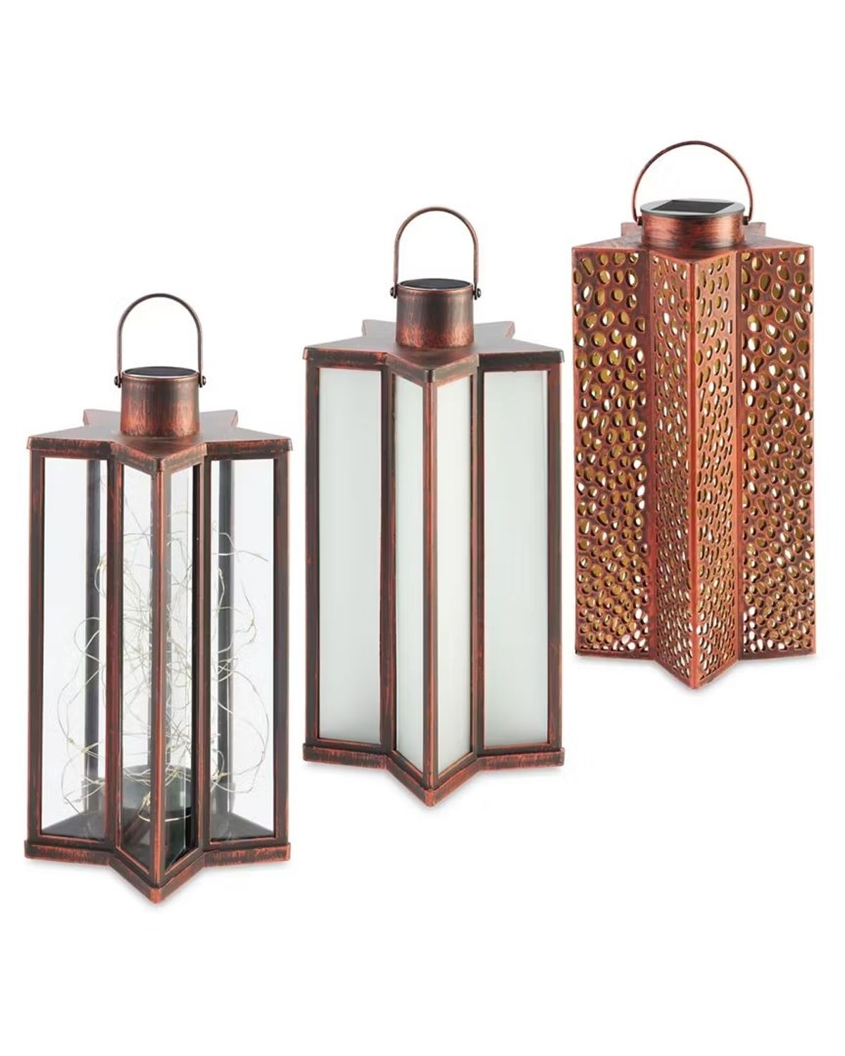 Three star shaped, copper coloured lanterns on a white background. One has clear panels, one has white panels and one has copper coloured hole cut-out pattern panels