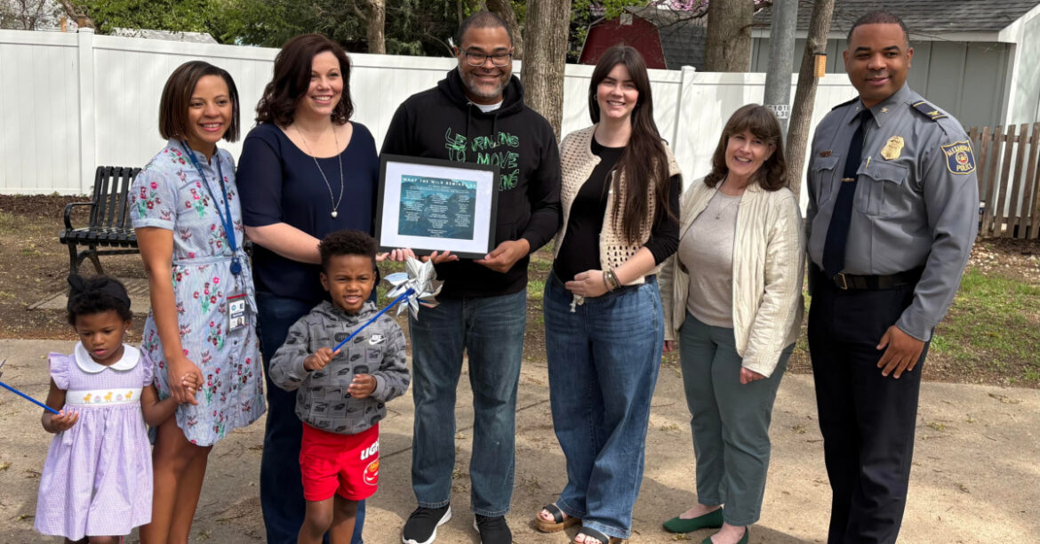 Alexandria Plants Pinwheel Garden for Child Abuse Prevention C. Thomas presenting his poem written for child abuse awareness to CAC and city officials.