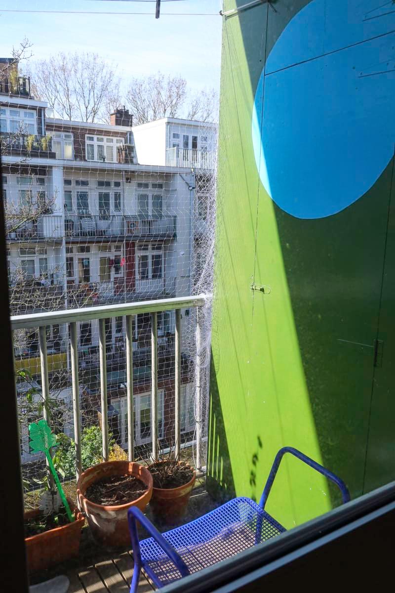 outdoor terrace with green and blue paint