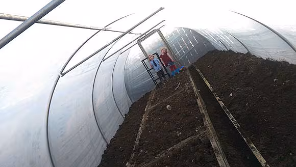 Getting the beds set up inside my tunnel