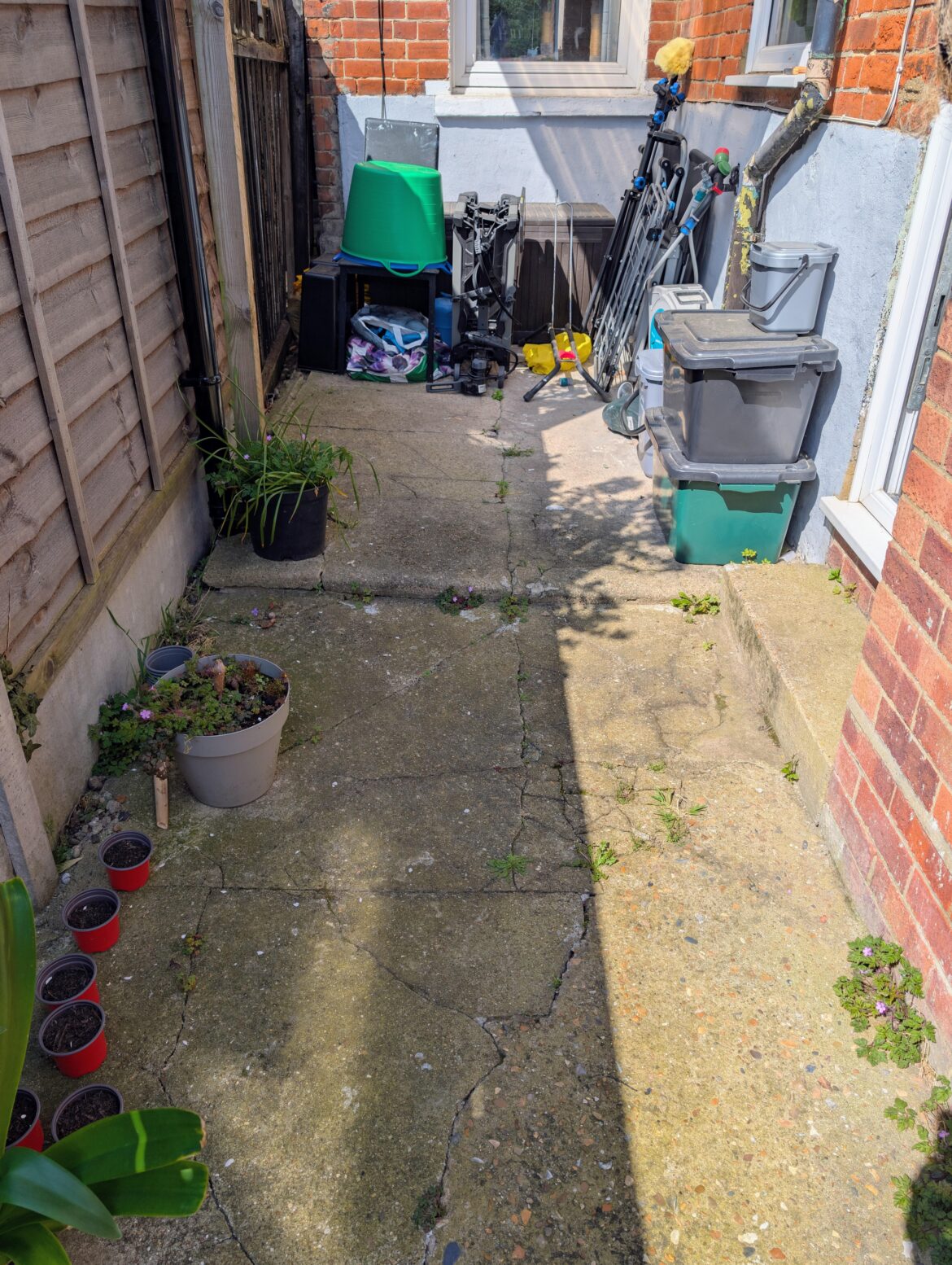 Suggestions for this space? Can I pave over this concrete?
