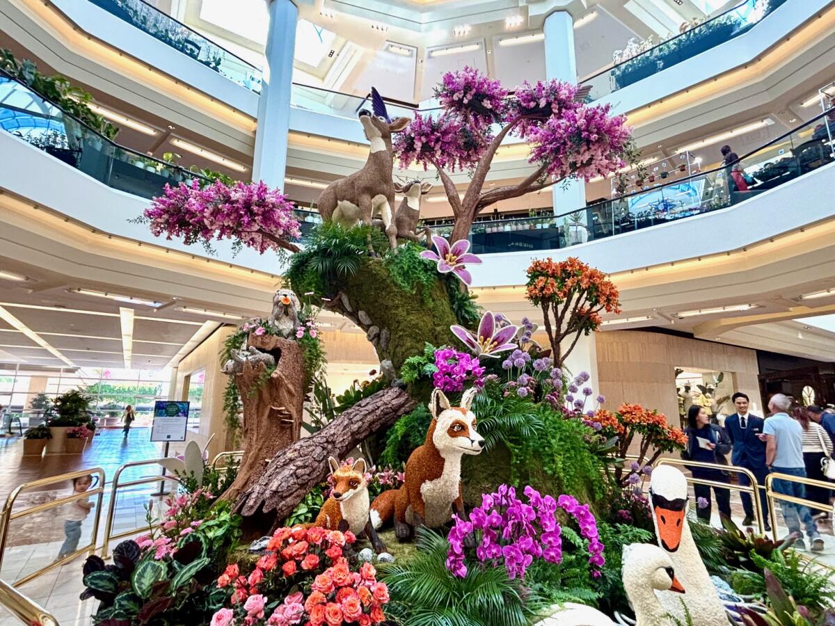 A botanical instillation from, built and designed by Fiesta Productions, with swans and foxes.