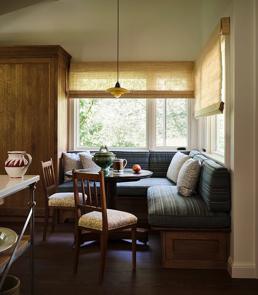 Cozy kitchen nook with seating and natural light.