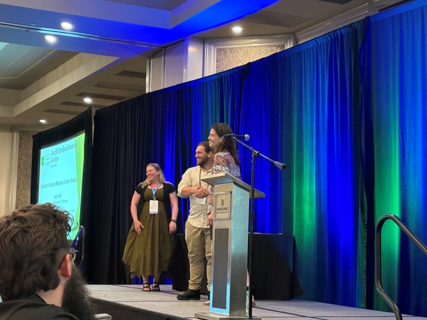 Andy Wall, center, receives the North Carolina Botanical Garden Award from Heather Joesting, left, president of the Association of Southeastern Biologists, and Scott Ward, research botanist at the North Carolina Botanical Garden. Photo courtesy of Dr. Gretchen Potts.