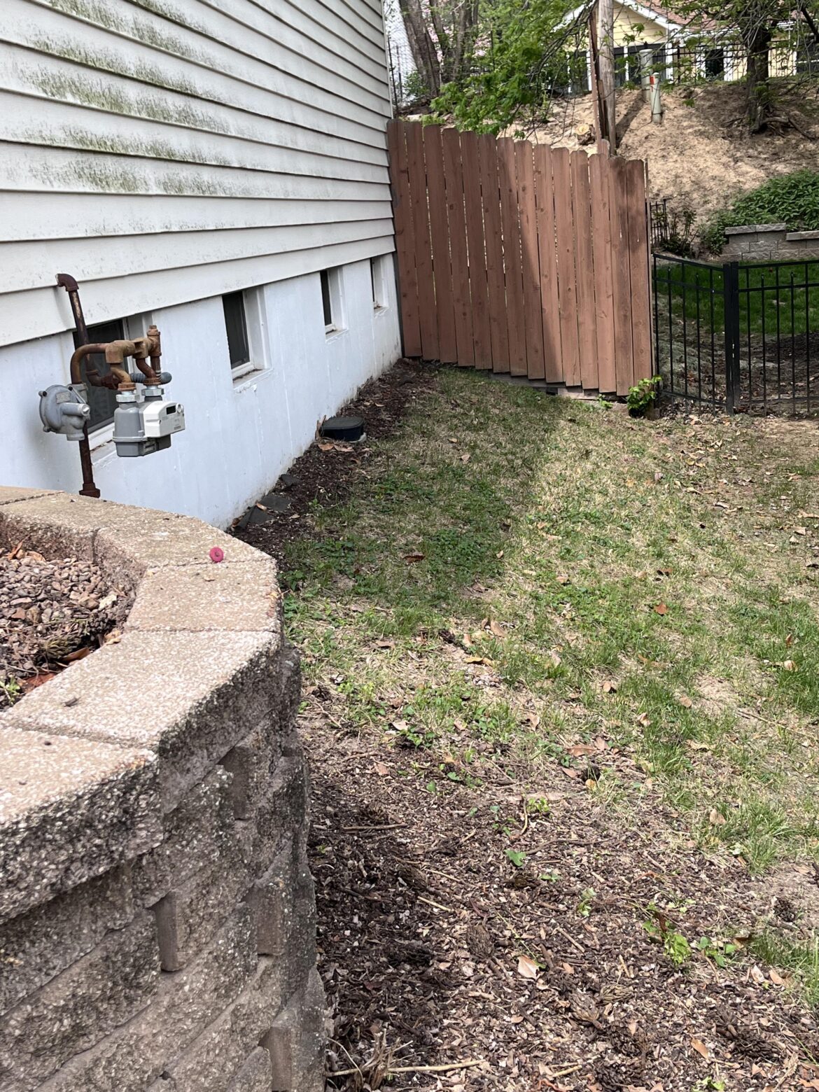 Would love ideas for this small hillside! Midwest USA, mostly shade with some sun in the morning