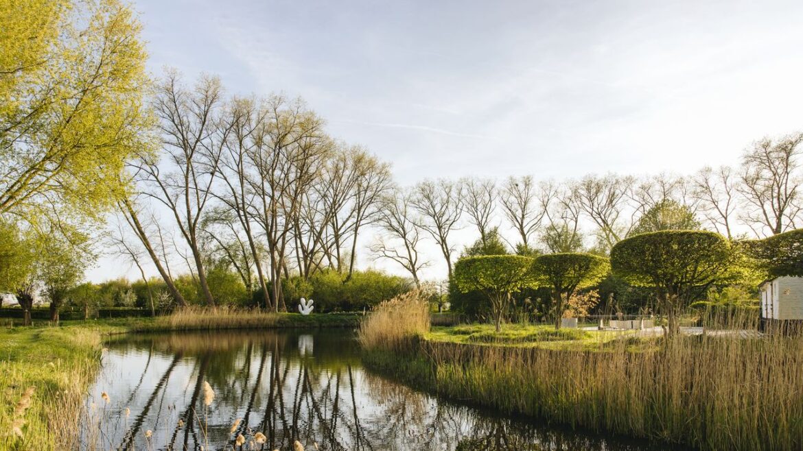 A fortified farmstead near Bruges whose free-flowing garden is shaped by art A fortified farmstead near Bruges whose free-flowing garden is shaped by art