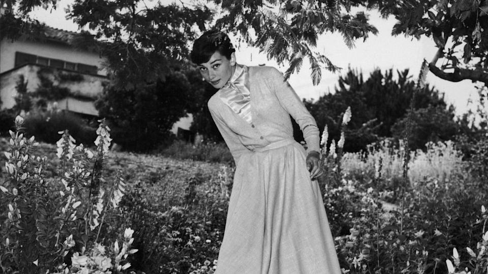 Audrey hepburn in a garden.