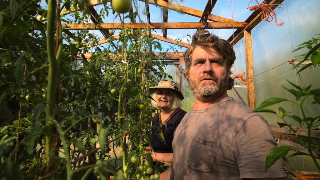 Netflix just dropped a new gardening show with Zach Galifianakis in time for Earth Day — and it’s a charming, funny docuseries you’ll want to binge-watch Zach Galifianakis stands in a greenhouse in a still from Netflix's "This Is a Gardening Show"
