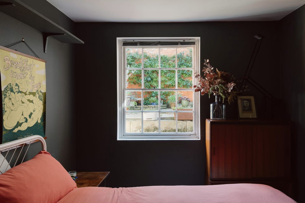interior view of a cozy bedroom with a window and decorative elements