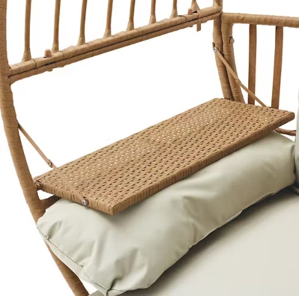 Aldi's egg chair with foldable table seating area with woven details and cushion