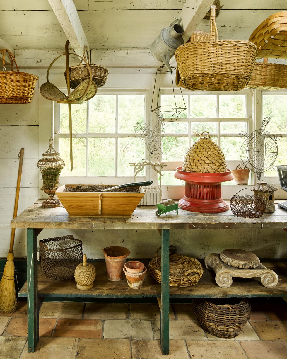 Rustic potting shed filled with gardening tools and baskets. Rustic potting shed filled with gardening tools and baskets.