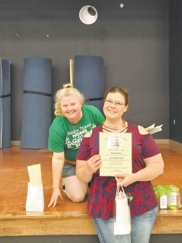 Tammy Balentine with Sweet T’s Treats of Sutherland Springs collects the “Welcome Home!” vendor award, for the way her booth said, “Come in and make yourself at home!”
