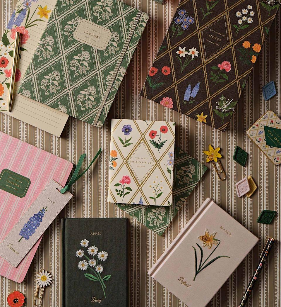 Collection of decorative notebooks and stationery items.