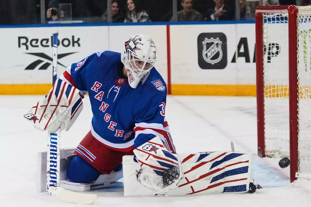 New York Rangers goaltender Igor Shesterkin (31) stops a shot during the first period of an NHL hockey game against the Ottawa Senators Monday, March 23, 2026, in New York. (AP Photo/Frank Franklin II)