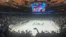 Audience members watch a PWHL hockey game between the New York Sirens and Seattle Torrent at Madison Square Garden in New York, Saturday, April 4, 2026. (AP Photo/Stephen Whyno)