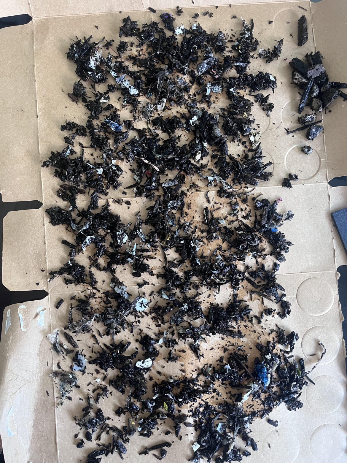 All the plastic, glass (snipe it?), and metal (a small broken ring) I sifted out of a single (1!) bag of MiracleGro “Garden Soil”.