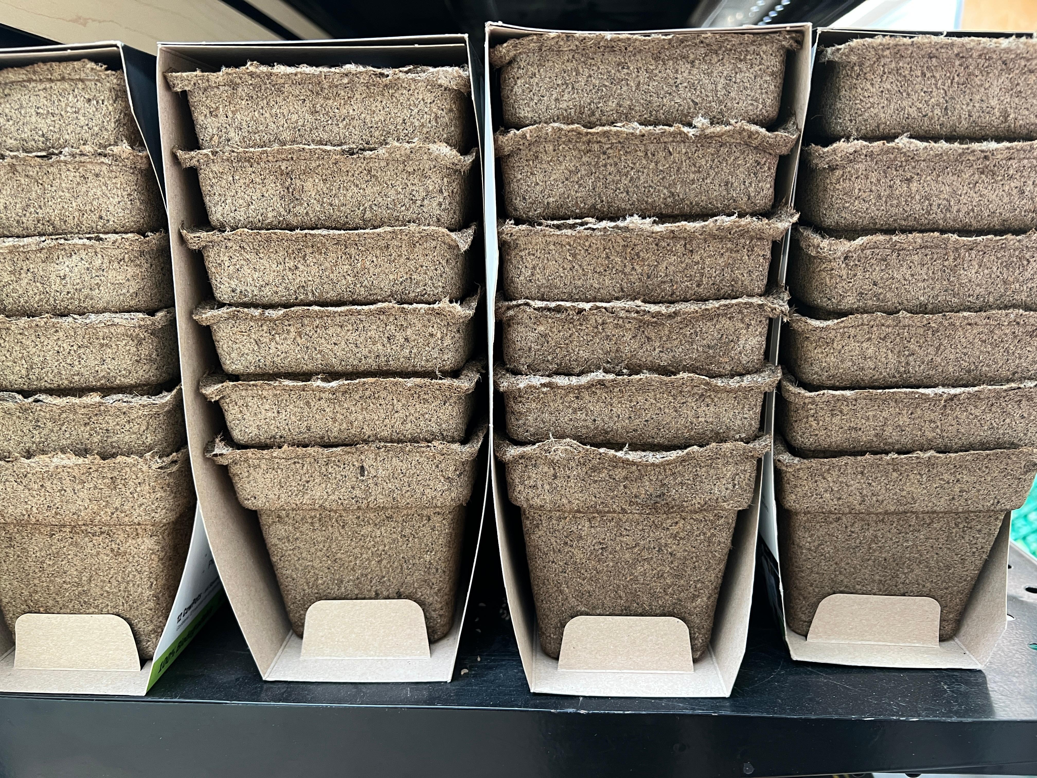Packages of plastic-free, manure-based planting pots