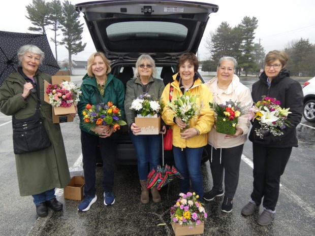 Members of The Garden Club of Springfield, with the floral arrangements that they delivered to Ronald McDonald House in Philadelphia are, from left, Lois Sellers of Springfield; Karen Giacomucci of Prospect Park; Cheryl Forte of Collingdale; Lillian Amadio and Jan Coppola, both of Springfield; and Mary Ellen Mulhern of Media. Other members who were part of the effort were Karen Smith of Secane and Anne Elliott of Media. (COURTESY OF SPRINGFIELD GARDEN CLUB)