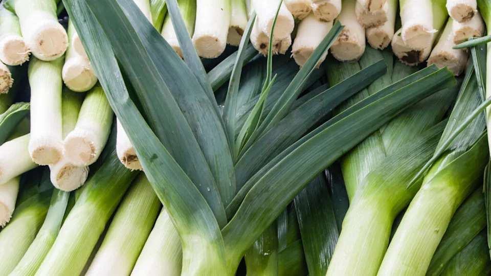 Display of fresh leeks at the farmers market