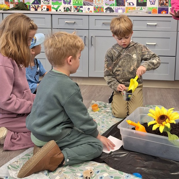 Students at Pottstown Children's Discovery Center create an indoor garden. (Photo by Diane Jacobs)